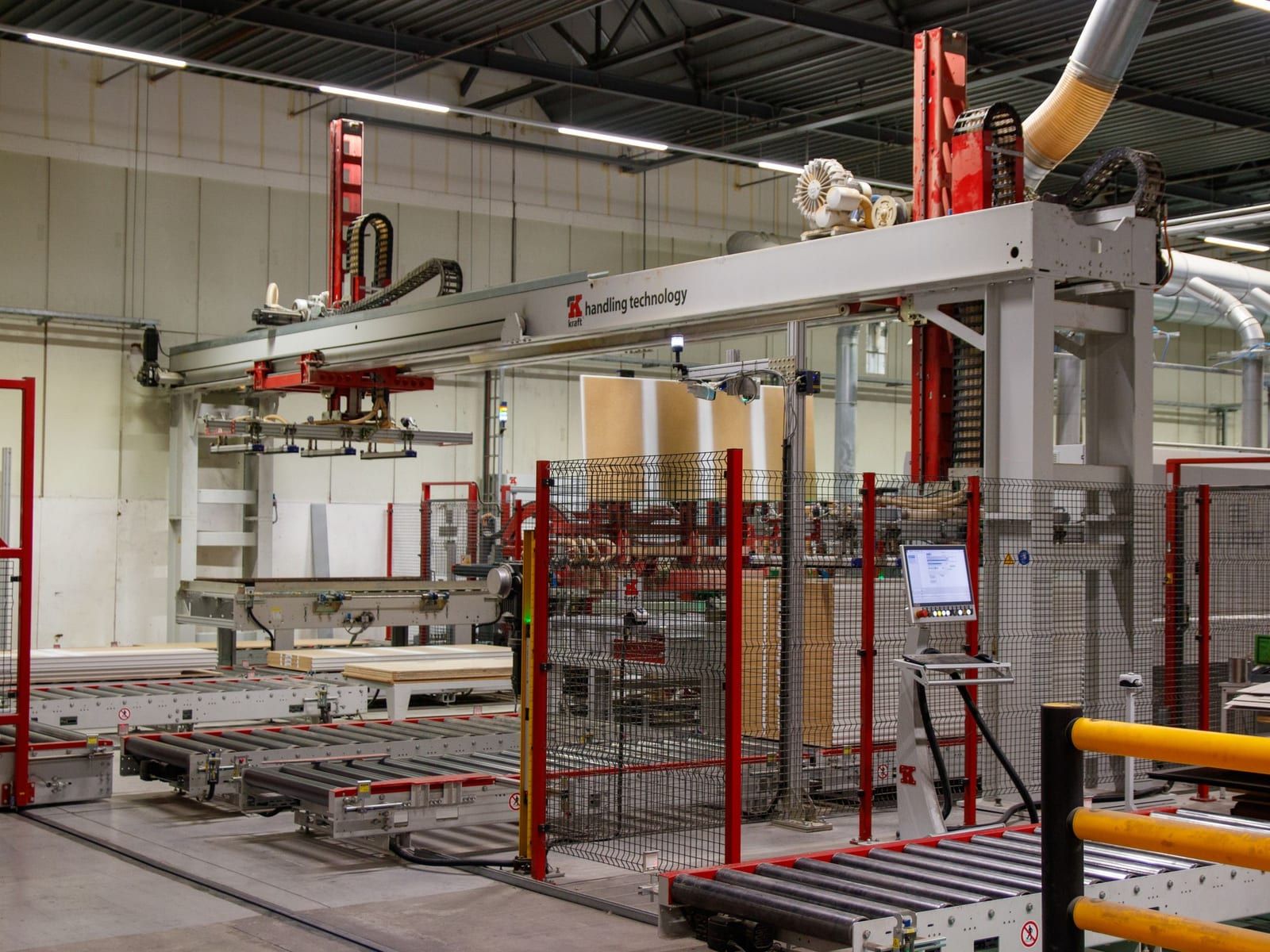 Palletizing robot placing cardboard boxes on a conveyor